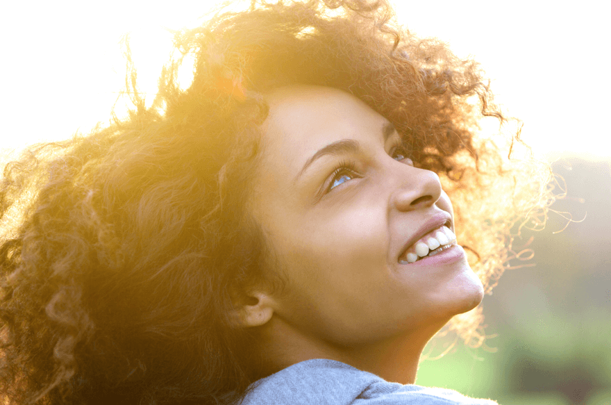 Woman smiling look up to the sky